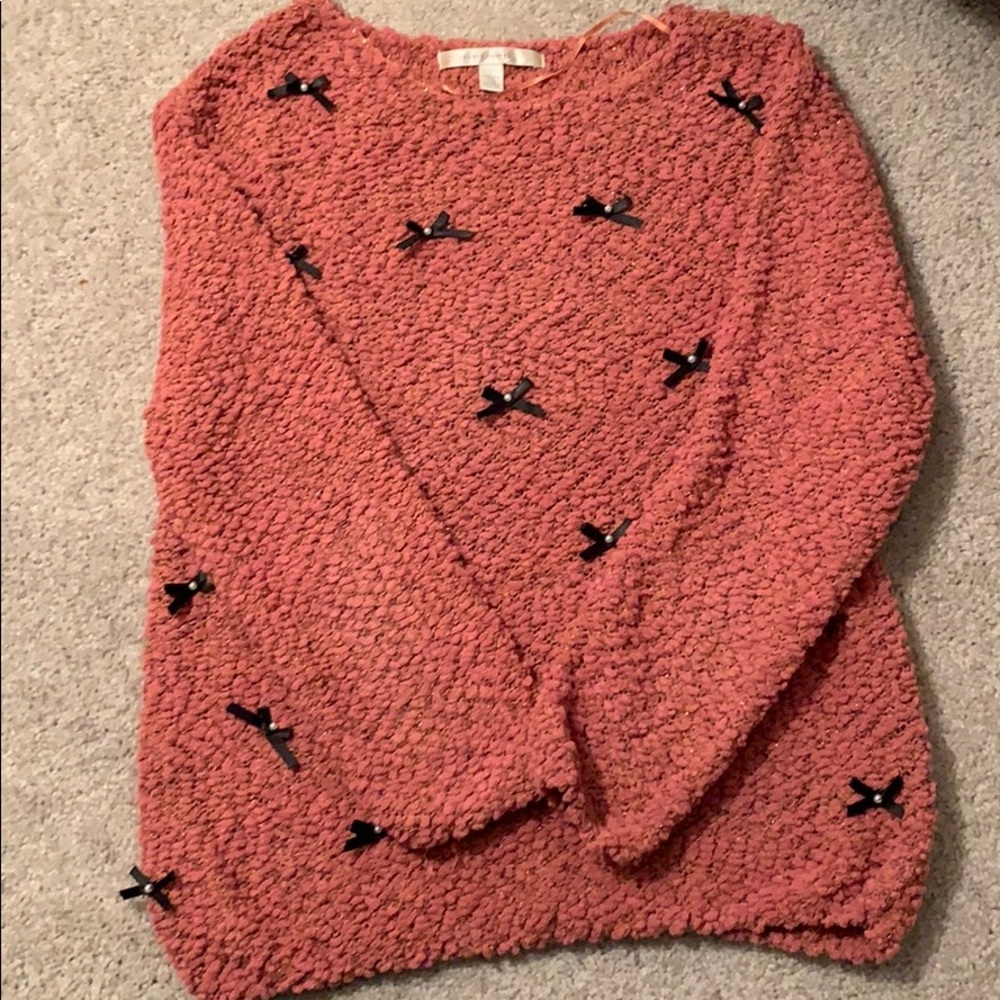 Blush pink sweater with black ribbon bows